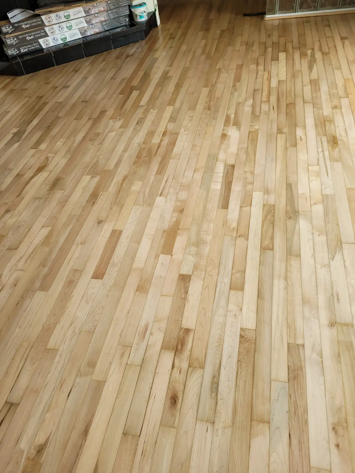 Maple hardwood flooring laid out during a residential installation